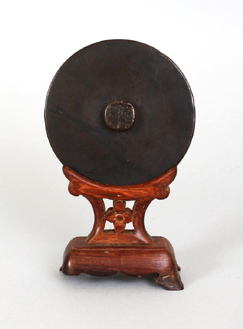 A SMALL CHINESE BRONZE MIRROR, possibly early, together (1 of 5)
