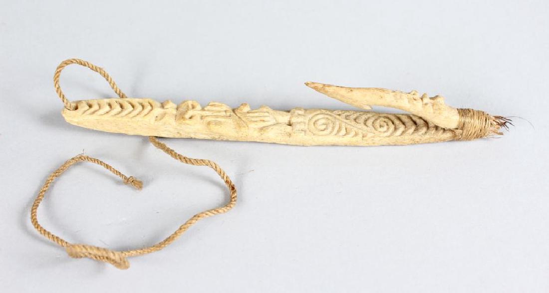 MAORI FISH HOOK, NEW ZEALAND Matau Carved bone, flax,: MAORI FISH HOOK, NEW ZEALAND Matau Carved bone, flax, the barb fixed at the base and bound tightly again with muka (flax fibre) cord. Height 7.5ins