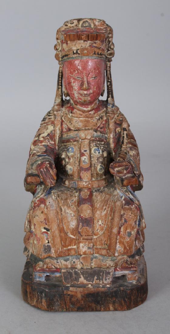 AN 18TH/19TH CENTURY CHINESE POLYCHROME CARVED WOOD: AN 18TH/19TH CENTURY CHINESE POLYCHROME CARVED WOOD FIGURE, of a seated emperor, the whole with traces of coloured pigment, 7in high.