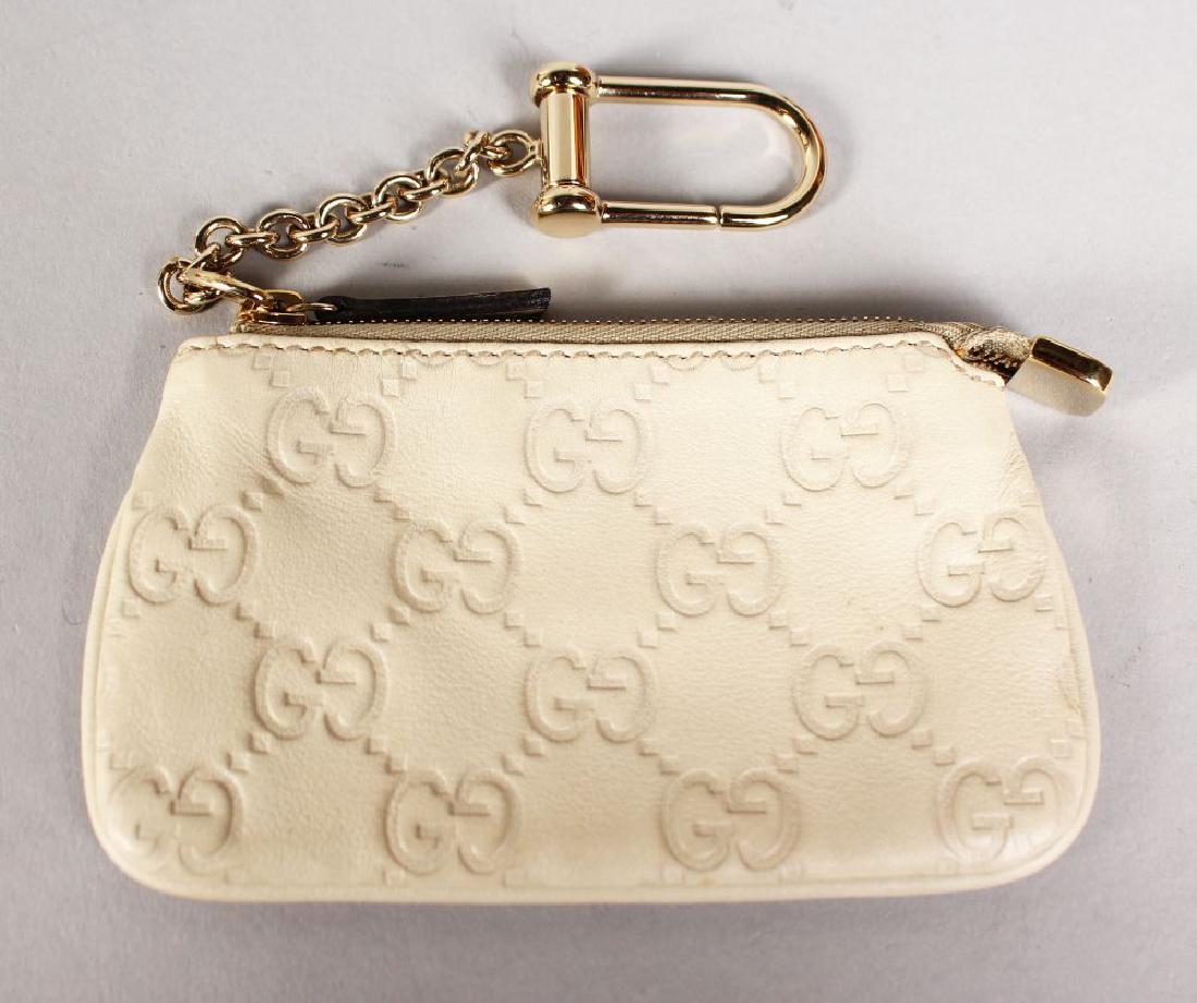 A GUCCI SMALL CREAM PURSE and A GUCCI SMALL YELLOW (1 of 2)