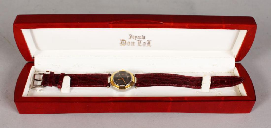 A LADIES BAUME & MERCIER AUTOMATIC WRISTWATCH with (1 of 2)