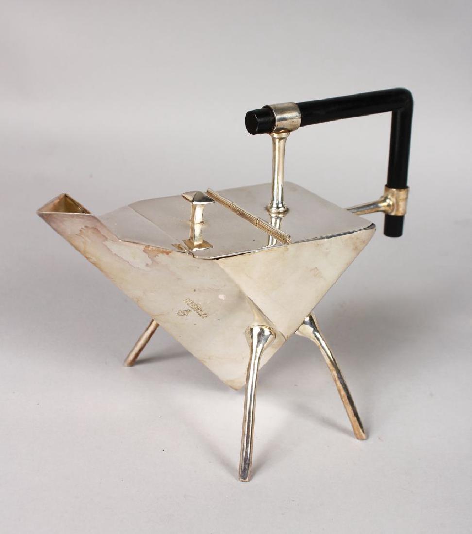 A GOOD CHRISTOPHER DRESSER DESIGN TEAPOT with ebony: A GOOD CHRISTOPHER DRESSER DESIGN TEAPOT with ebony handle, on four outstretched legs.