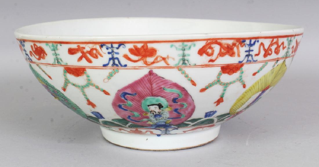 A CHINESE FAMILLE ROSE BARAGON TUMID MONGOLIAN MARKET: A CHINESE FAMILLE ROSE BARAGON TUMID MONGOLIAN MARKET PORCELAIN BOWL, the sides decorated with six leaf-form Regal Treasure cartouches between borders of the Eight Buddhist Emblems, the interior with