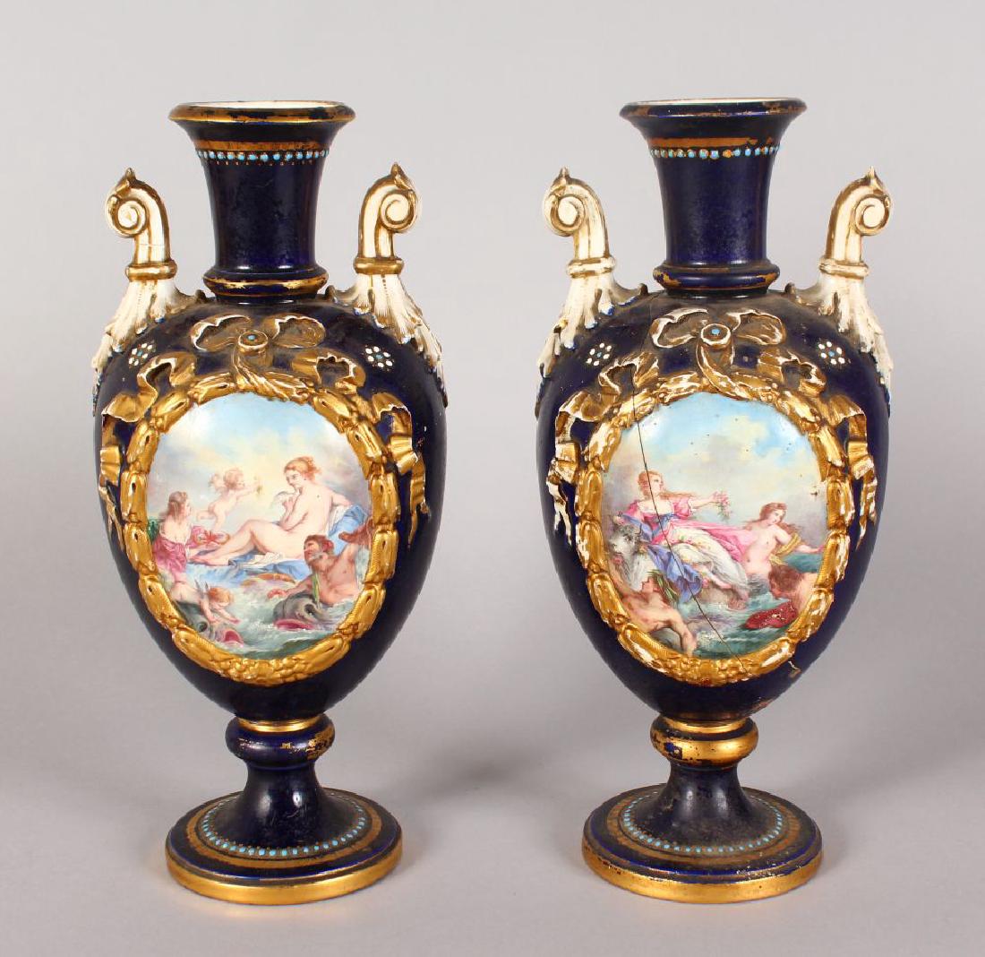 A PAIR OF CONTINENTAL TWO HANDLED VASES, painted with (1 of 1)
