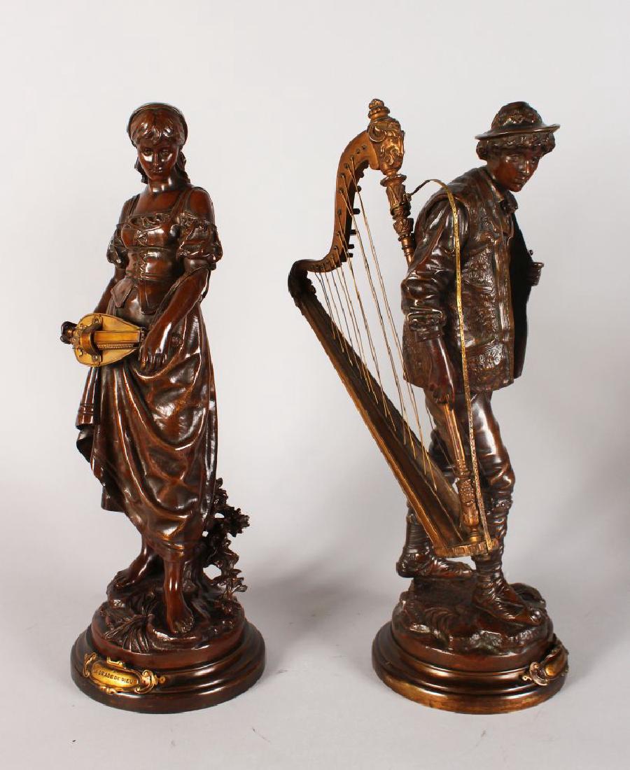 EUTROPE BOURET (1833-1906) FRENCH "A LA GRACE DE DIEU": EUTROPE BOURET (1833-1906) FRENCH "A LA GRACE DE DIEU" AND "SANS FAMILLE", the girl playing a hurdy-gurdy, the man carrying a harp. Signed, on circular bases with inscription. 19ins high.