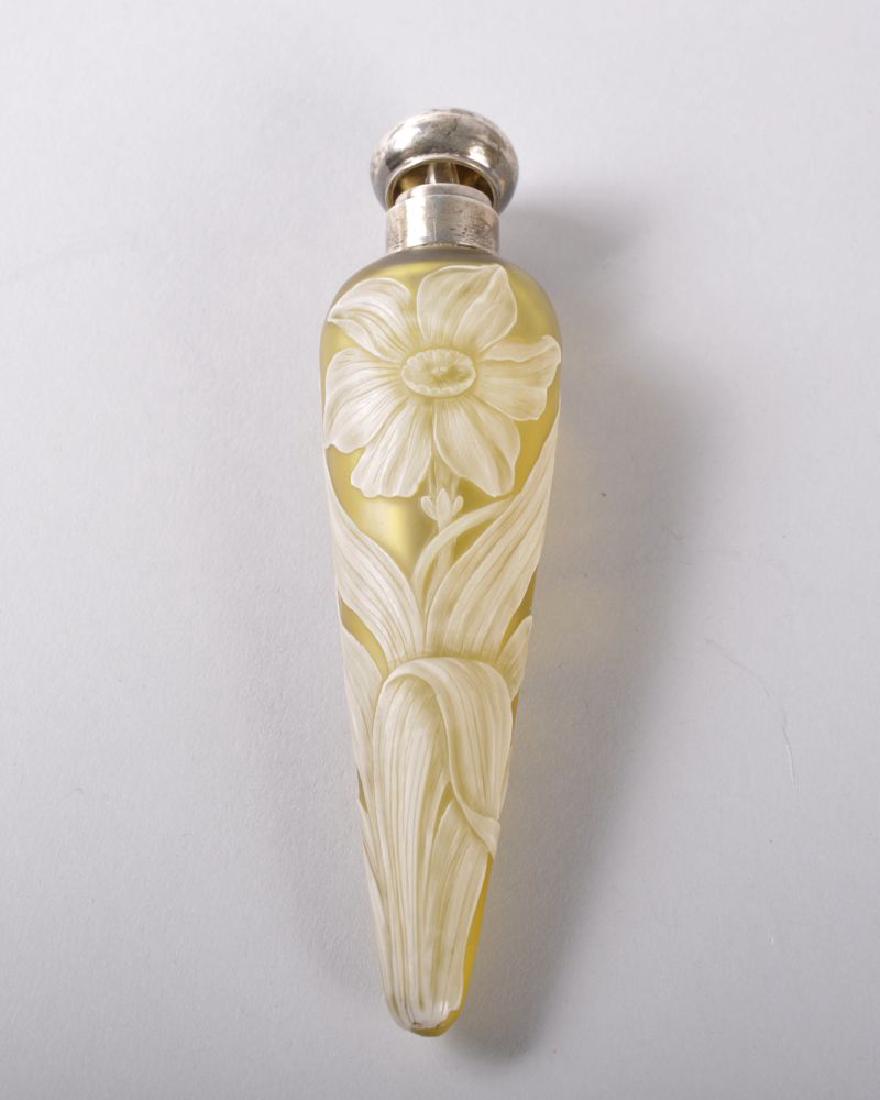 A SUPERB CONICAL CAMEO GLASS PERFUME BOTTLE by THOMAS: A SUPERB CONICAL CAMEO GLASS PERFUME BOTTLE by THOMAS WEBB with silver band and top, Birmingham 1885, opaque white decoration of a narcissus on yellow ground. 12cms long. See Lambert Page 100. Provena