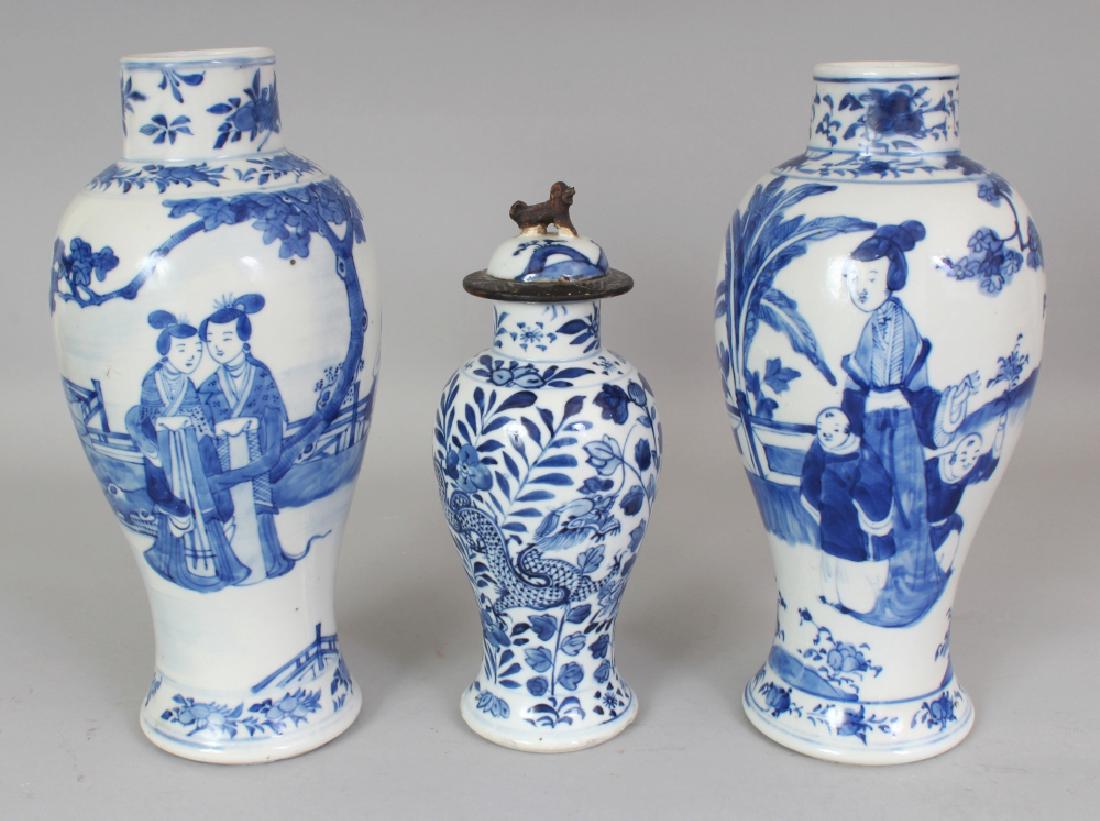 THREE 19TH CENTURY CHINESE BLUE & WHITE PORCELAIN: THREE 19TH CENTURY CHINESE BLUE & WHITE PORCELAIN VASES, and a non-matching cover, each base with a four-character Kangxi mark, the largest vase 10.6in high. (3)