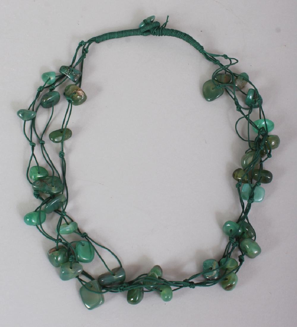 A GREEN HARDSTONE MULTI-STRAND NECKLACE, composed of (1 of 3)