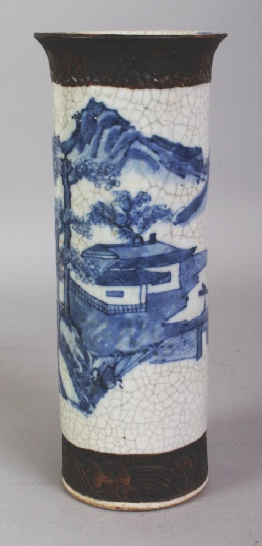 A CHINESE BLUE & WHITE CYLINDRICAL CRACKLEGLAZE: A CHINESE BLUE & WHITE CYLINDRICAL CRACKLEGLAZE PORCELAIN VASE, circa 1900, the sides painted with a continuous river landscape scene, the base with an incised Chenghua mark, 10.2in high.