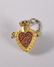 A MINIATURE HEART SHAPED GILT PERFUME BOTTLE on a
