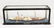 A MINIATURE BOAT in a glass case. 7ins long.