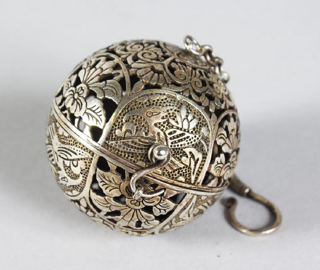 A CHINESE PIERCED SILVER TRAVELLING CENSER.  2ins (1 of 2)