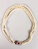 A VERY GOOD TRIPLE ROW PEARL NECKLACE with ruby and