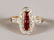 A 9CT GOLD, CALIBRE CUT RUBY AND DIAMOND DECO TYPE