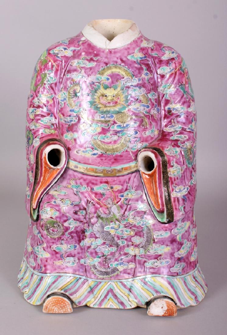 AN UNUSUAL 19TH CENTURY DAOGUANG PERIOD FAMILLE ROSE: AN UNUSUAL 19TH CENTURY DAOGUANG PERIOD FAMILLE ROSE PORCELAIN MODEL OF A SEATED EMPEROR’S COSTUME, the base unglazed, 11.75in high.