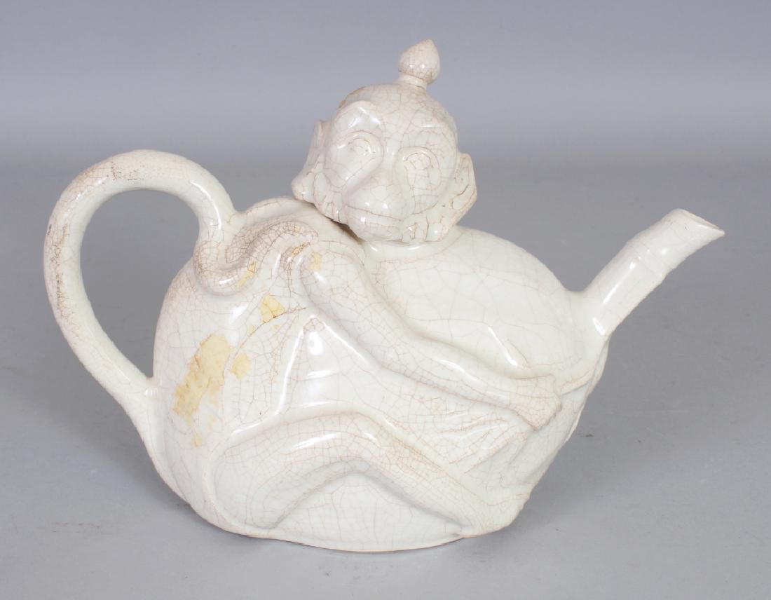 AN ORIENTAL WHITE CRACKLE GLAZED MONKEY FORM PORCELAIN (1 of 5)