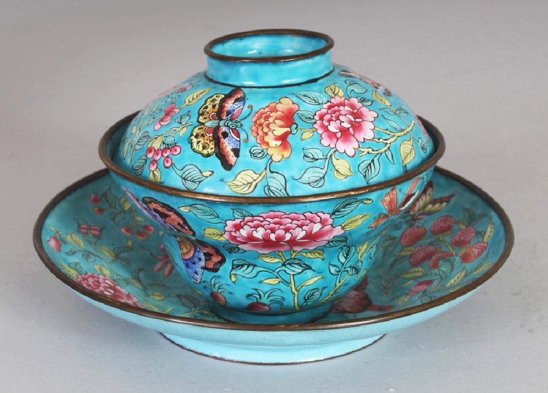 A 19TH CENTURY CHINESE TURQUOISE GROUND FAMILLE ROSE: A 19TH CENTURY CHINESE TURQUOISE GROUND FAMILLE ROSE CANTON ENAMEL TEABOWL, COVER & STAND, each piece decorated with butterflies and foliage, the stand 6.1in diameter, the teabowl & cover 3.4in high o
