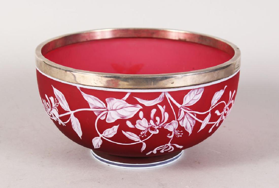 A SUPERB THOMAS WEBB & SONS CAMEO PINK AND WHITE: A SUPERB THOMAS WEBB & SONS CAMEO PINK AND WHITE CIRCULAR FRUIT BOWL, with hallmarked silver rim, the body with flowers and butterflies. 9ins diameter, 5ins high. Cameo signature on the base.