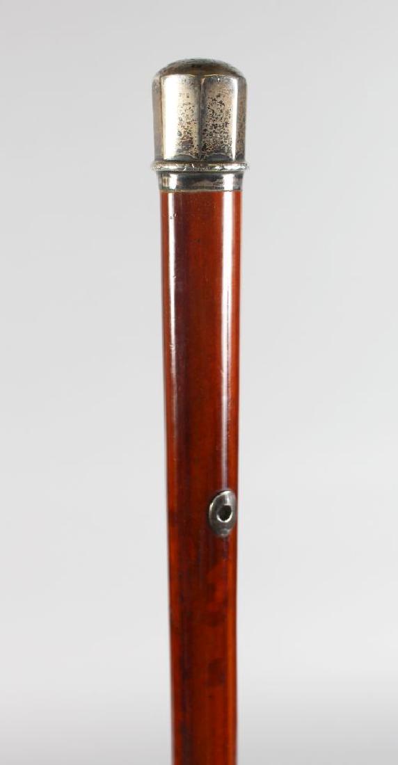 A CANE WITH WHIP, WITH SILVER TOP. (1 of 2)