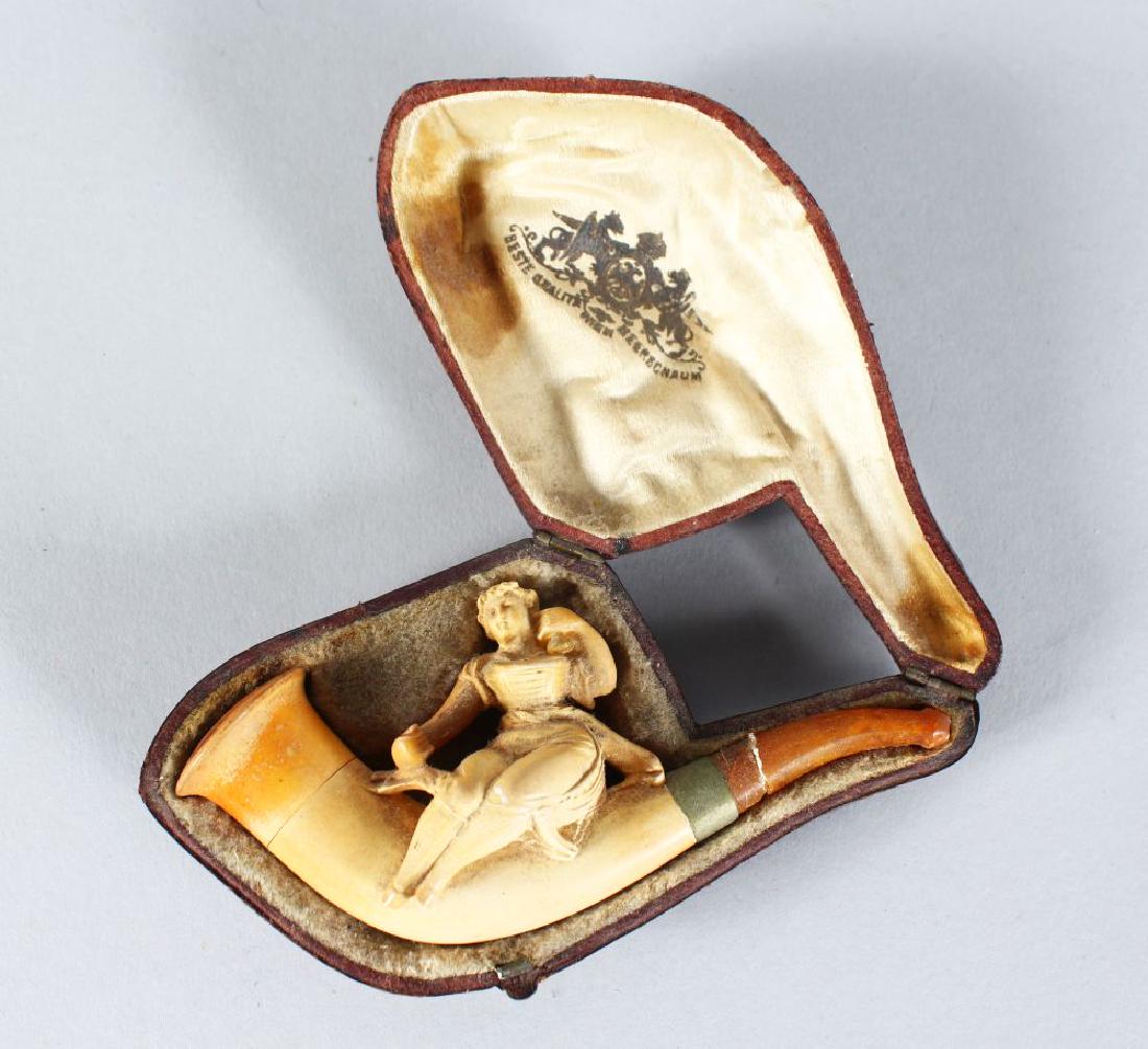 A MEERSCHAUM PIPE, young lady in a leather case.: A MEERSCHAUM PIPE, young lady in a leather case.