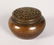 A TINY BRONZE CHINESE CIRCULAR CENSER. 1.75ins.