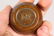 A TINY BRONZE CHINESE CIRCULAR CENSER. 1.75ins. - 2