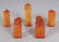 A SET OF FIVE SMALL CHINESE STONE SEALS, contained in a