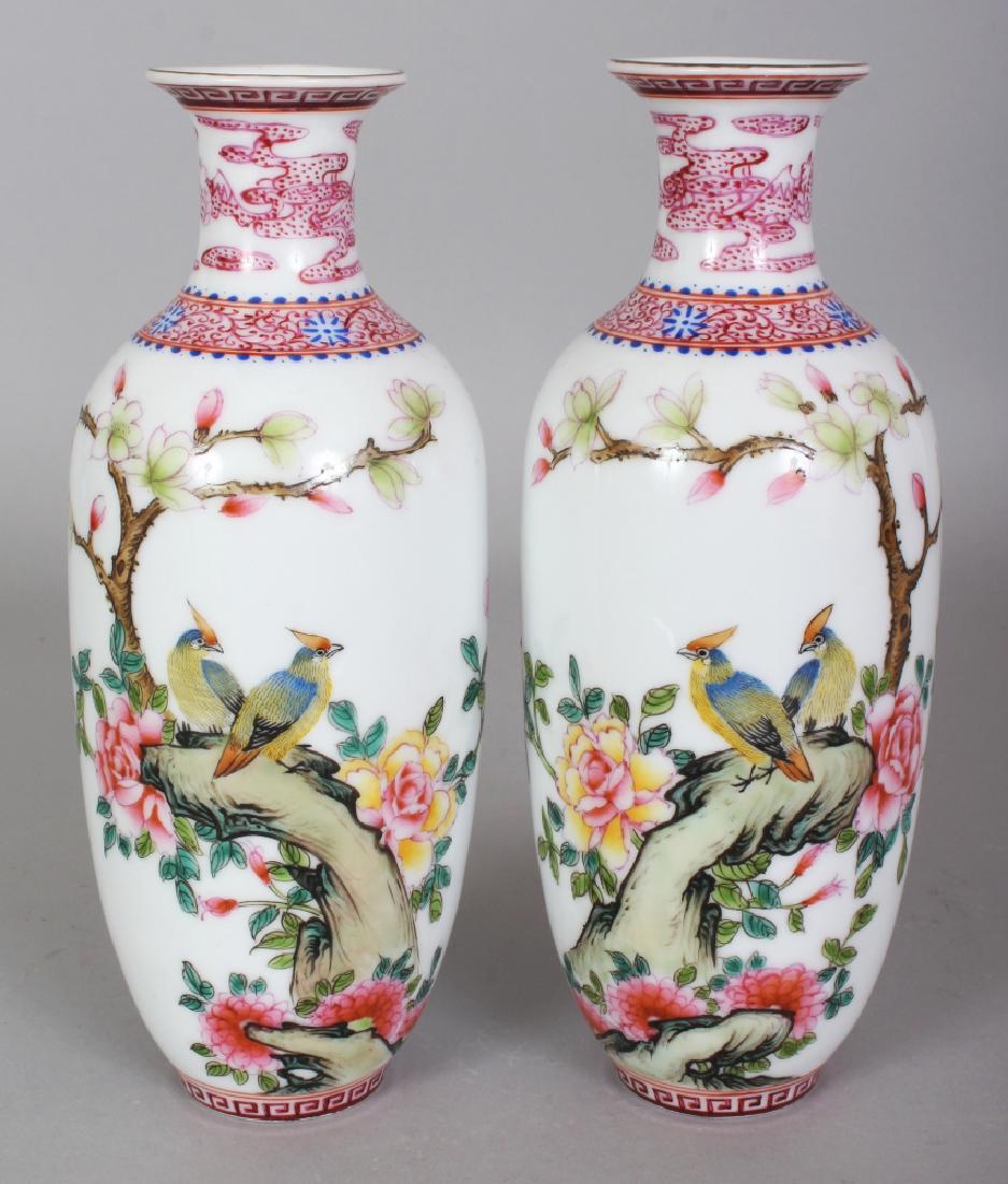 A MIRROR PAIR OF CHINESE REPUBLIC STYLE FAMILLE ROSE: A MIRROR PAIR OF CHINESE REPUBLIC STYLE FAMILLE ROSE PORCELAIN VASES, each base with a six-character Yongzheng mark in blue enamel, 8.3in high.