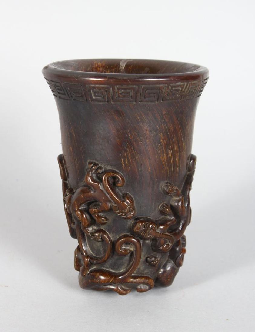 A CHINESE HORN LIBATION CUP, carved with Chih Long. (1 of 2)