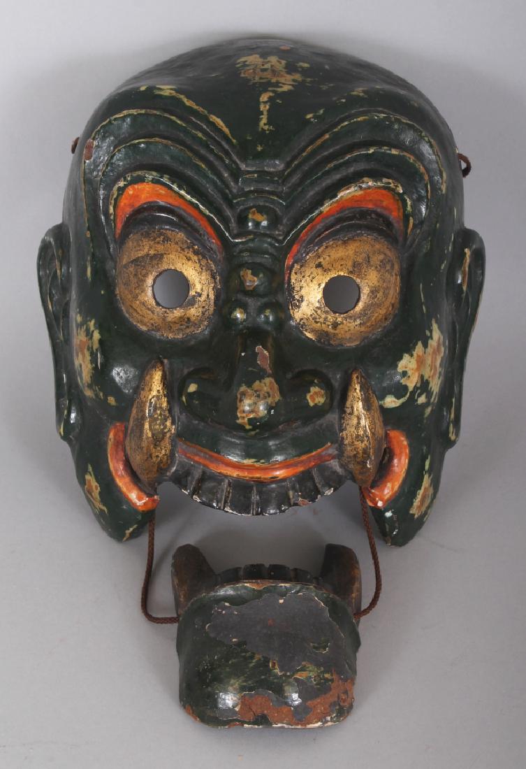 AN EARLY 20TH CENTURY JAPANESE LACQUERED WOOD DEMON NOH: AN EARLY 20TH CENTURY JAPANESE LACQUERED WOOD DEMON NOH MASK, with cord dependant separate jaw, the mask itself 8.25in wide x 9in high.