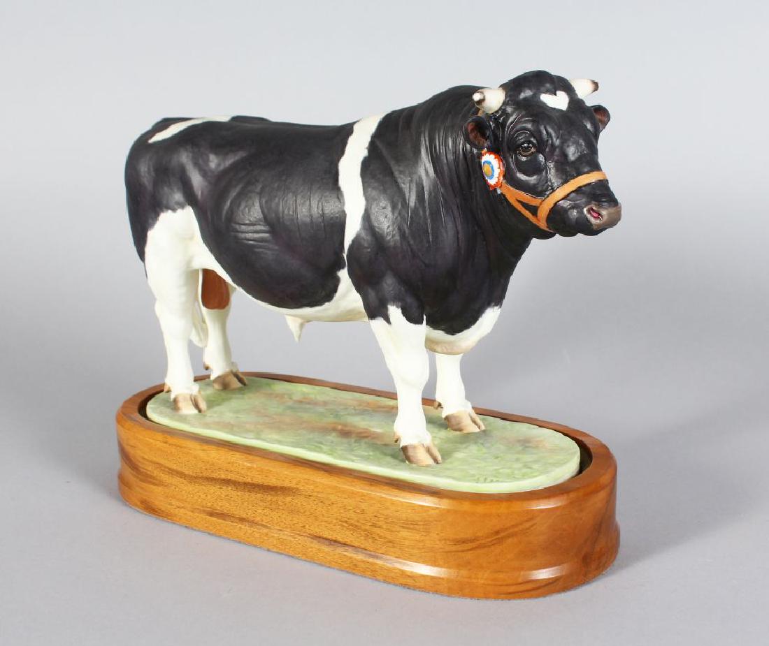A ROYAL WORCESTER BRITISH FRIESIAN BULL, modelled by: A ROYAL WORCESTER BRITISH FRIESIAN BULL, modelled by DORIS LINDNER 1964 No: 4438, on a wooden stand. 6ins long.