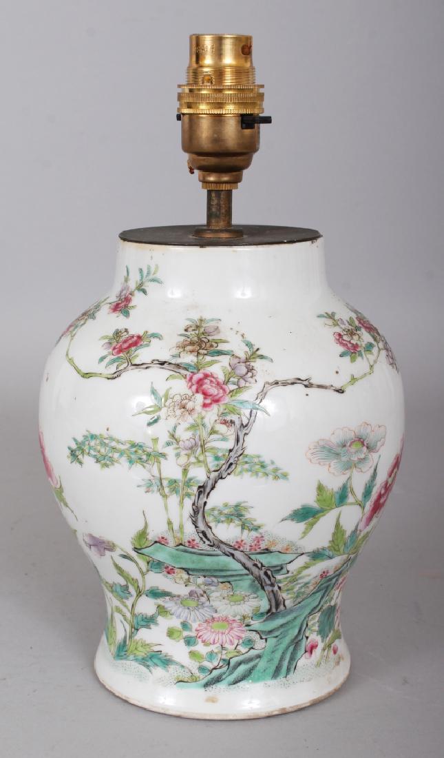 A GOOD QUALITY 19TH CENTURY FAMILLE ROSE PORCELAIN: A GOOD QUALITY 19TH CENTURY FAMILLE ROSE PORCELAIN VASE, fitted for electricity, 9.9in high overall, the vase itself 6.9in high.