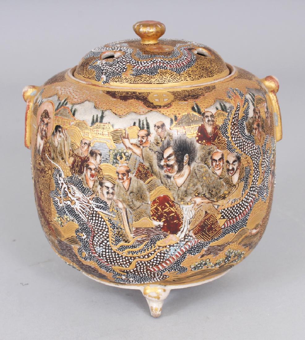 A SIGNED JAPANESE MEIJI PERIOD SATSUMA EARTHENWARE: A SIGNED JAPANESE MEIJI PERIOD SATSUMA EARTHENWARE TRIPOD KORO & COVER, the sides painted with Sennin in the company of a dragon, the base with a maker’s mark, 5in high overall.