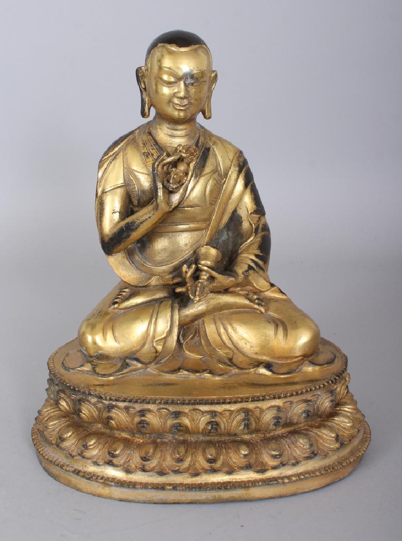 A SINO-TIBETAN GILT BRONZE FIGURE OF A LAMA, seated in (1 of 6)