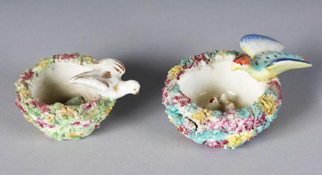TWO SMALL STAFFORDSHIRE ENCRUSTED BIRD NESTS with bird: TWO SMALL STAFFORDSHIRE ENCRUSTED BIRD NESTS with bird and eggs.