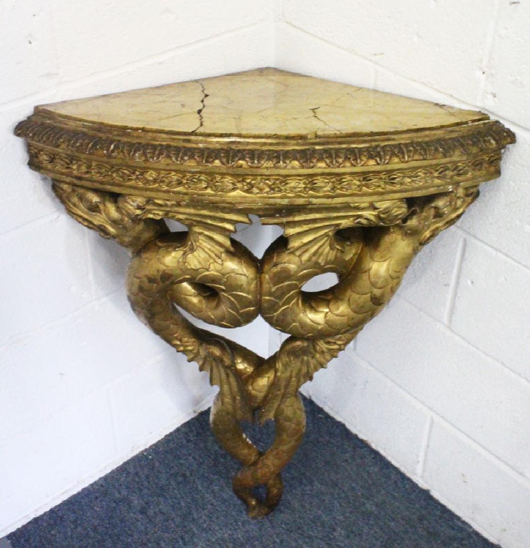 A VERY GOOD PAIR OF 18TH CENTURY CARVED AND GILDED: A VERY GOOD PAIR OF 18TH CENTURY CARVED AND GILDED CONSOLE TABLES, with one marble top, the frames as cross serpents. 2ft 3ins wide x 3ft high.