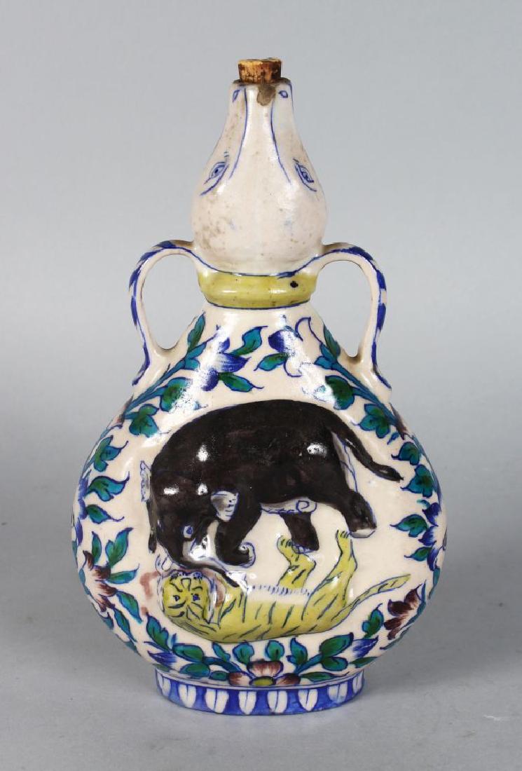 AN INDIAN POTTERY FIGURE with elephant and tiger. (1 of 3)