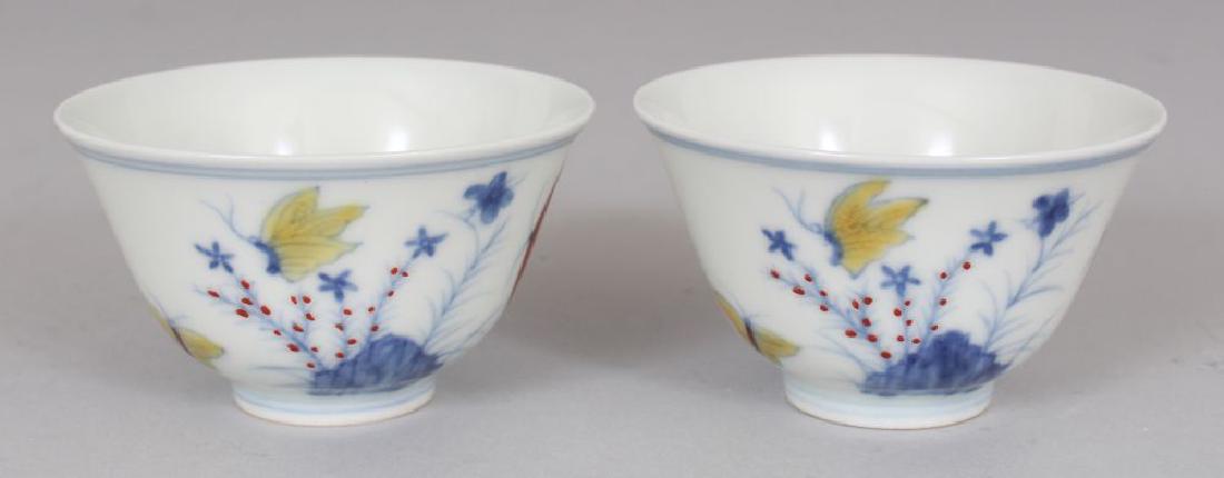 A PAIR OF MING STYLE DOUCAI PORCELAIN CUPS, decorated (1 of 7)
