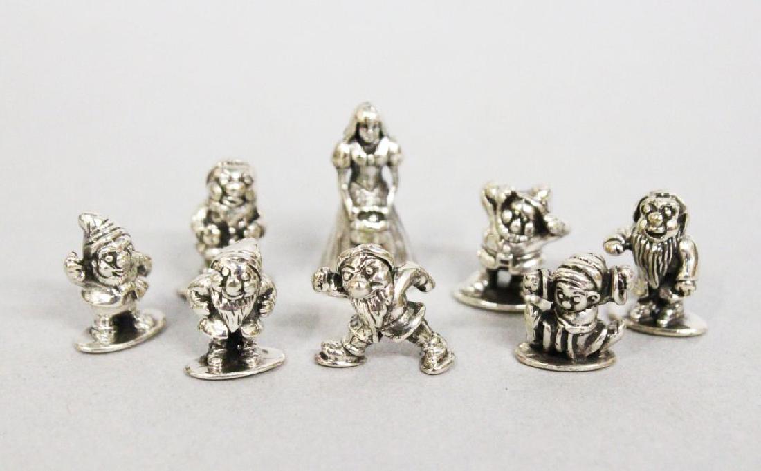 A SET OF SILVER MINIATURES, SNOW WHITE AND THE SEVEN: A SET OF SILVER MINIATURES, SNOW WHITE AND THE SEVEN DWARFS.