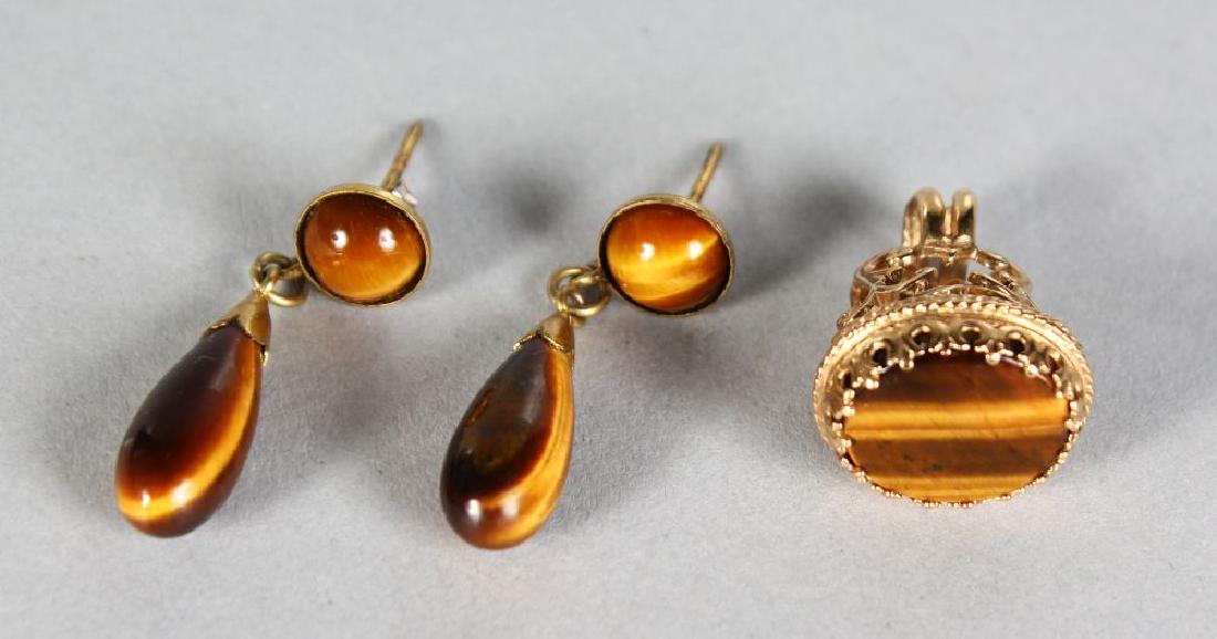 A GOLD TIGER'S EYE FOB AND PAIR OF EARRINGS. (1 of 1)