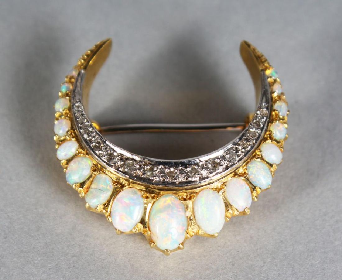 AN 18CT GOLD, DIAMOND AND OPAL CRESCENT BROOCH. (1 of 1)