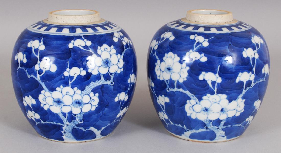 A NEAR PAIR OF 19TH/20TH CENTURY CHINESE BLUE & WHITE: A NEAR PAIR OF 19TH/20TH CENTURY CHINESE BLUE & WHITE PORCELAIN PRUNUS JARS, each with a short unglazed neck, 5.2in high.