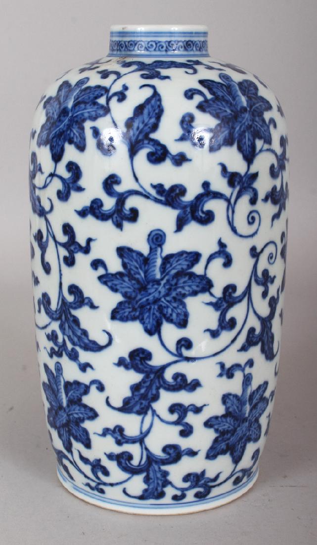 A CHINESE MING STYLE BLUE & WHITE PORCELAIN VASE,: A CHINESE MING STYLE BLUE & WHITE PORCELAIN VASE, decorated with formal scrolling foliage, the base with a six-character Yongzheng mark, 9.8in high.