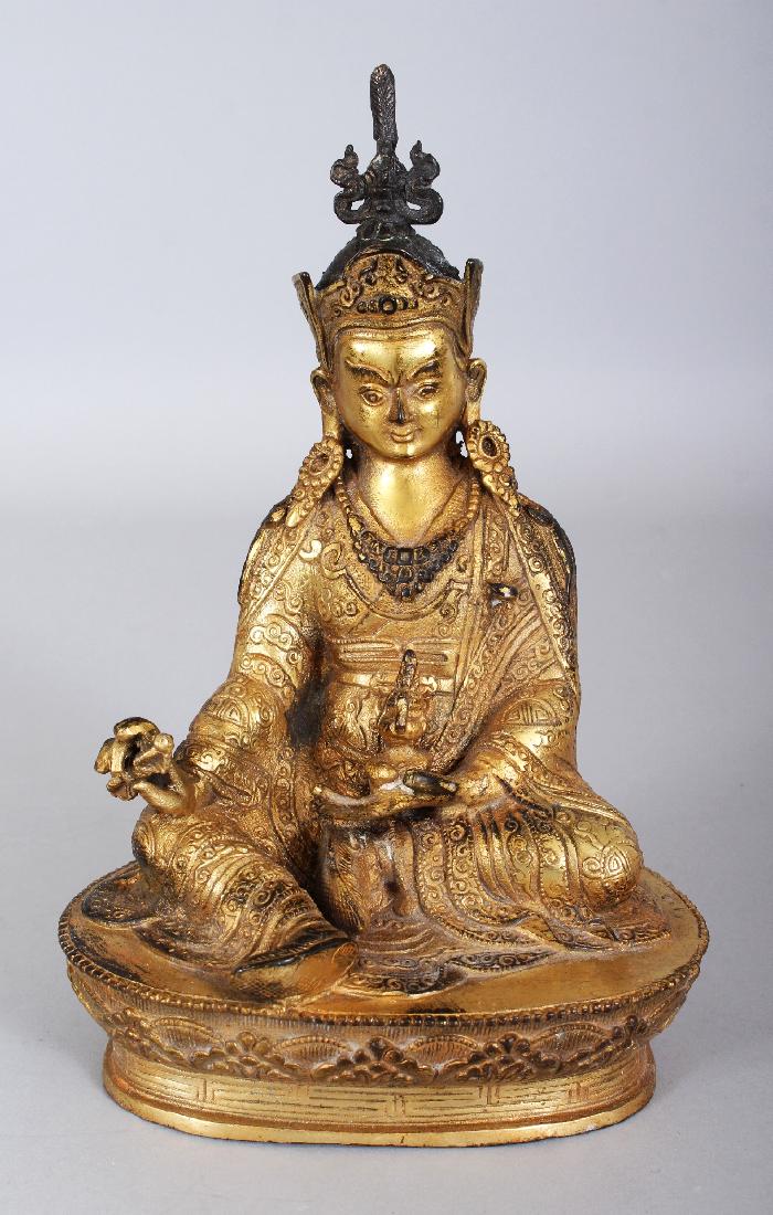 A SINO-TIBETAN GILT BRONZE FIGURE OF A KARMAPA, seated (1 of 7)