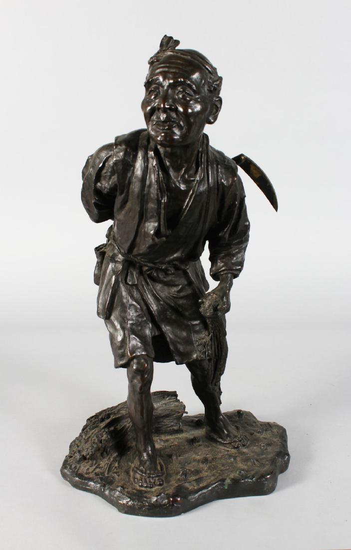 A SUPERB JAPANESE BRONZE of a man carrying a scythe. (1 of 4)