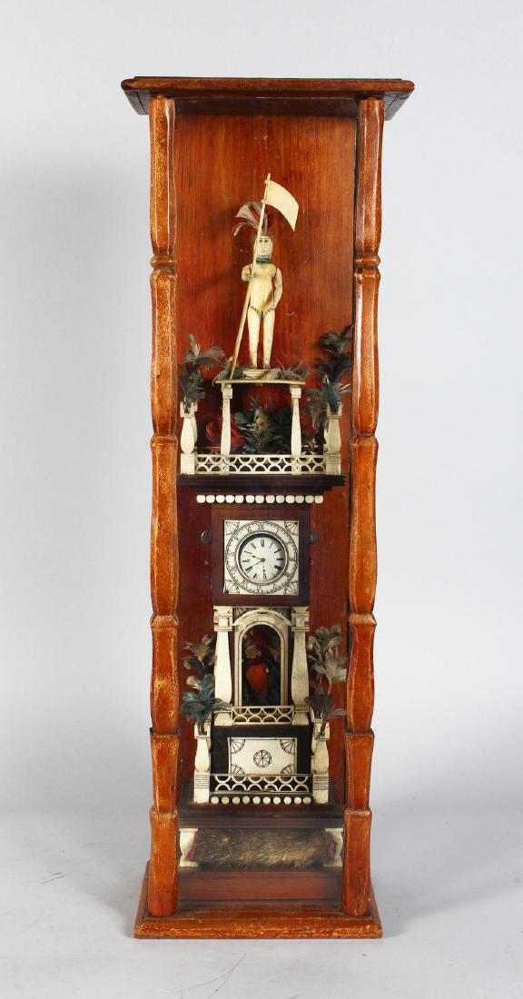 AN IMPRESSIVE AMERICAN 18TH / 19TH CENTURY SCRIMSHAW: AN IMPRESSIVE AMERICAN 18TH / 19TH CENTURY SCRIMSHAW WATCH TOWER, with beaver skin fur pelt purse in the base, flowers, feathers and a pocket watch, surmounted by a carved native Indian female figure