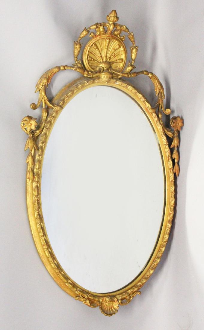 A 19TH CENTURY OVAL GILT FRAMED MIRROR, with shell (1 of 1)