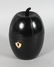 AN EBONISED MELON SHAPE TEA CADDY. 6.5ins high.