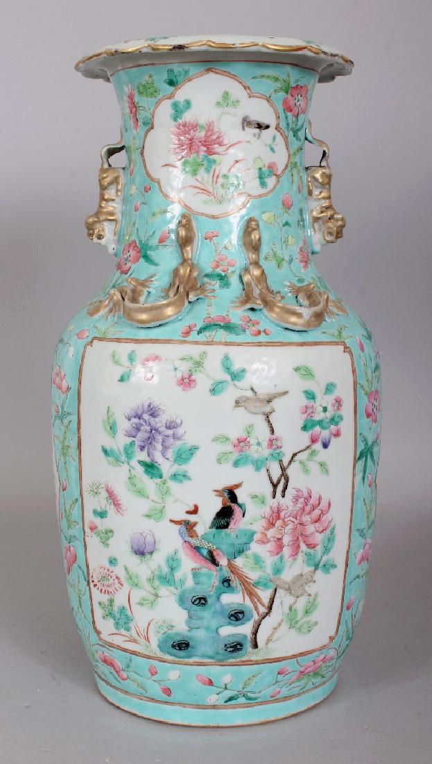 A 19TH CENTURY CHINESE CANTON FAMILLE ROSE TURQUOISE: A 19TH CENTURY CHINESE CANTON FAMILLE ROSE TURQUOISE GROUND PORCELAIN VASE, painted with panels of birds and foliage, 14in high.