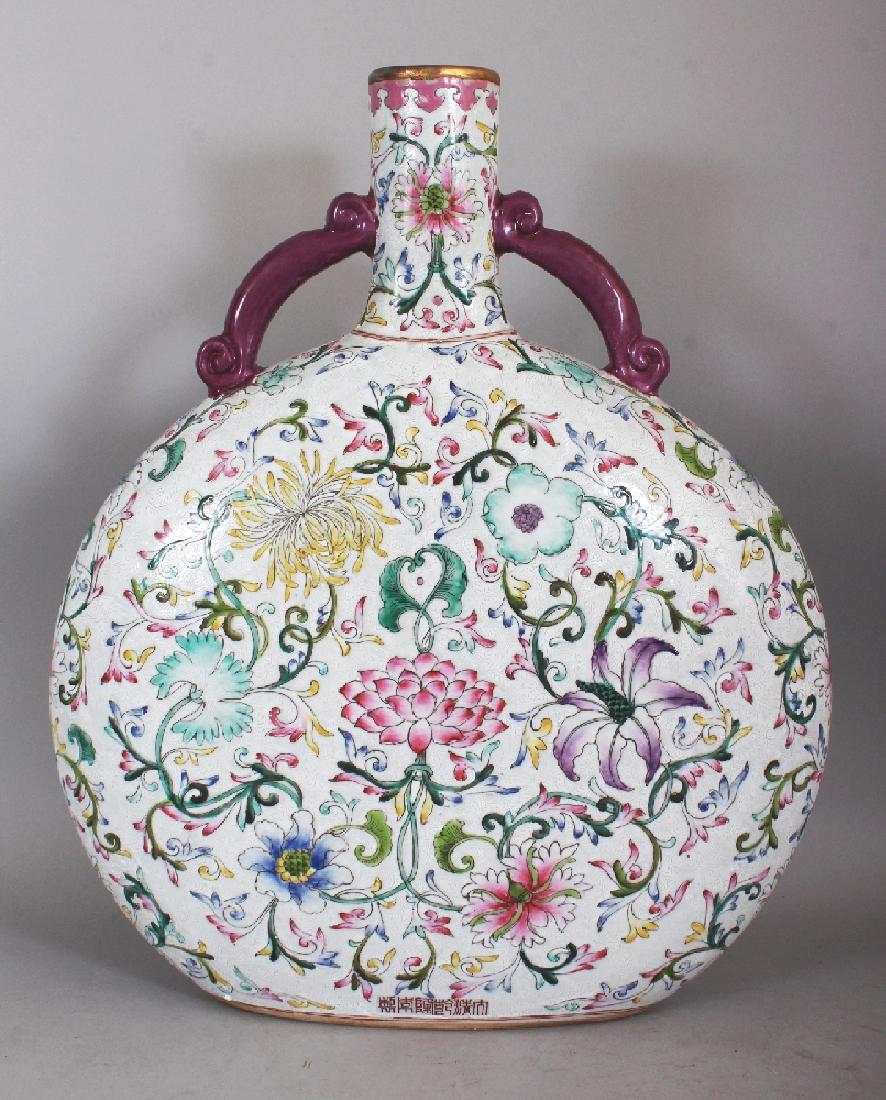 A LARGE 20TH CENTURY CHINESE SGRAFFITO GROUND FAMILLE: A LARGE 20TH CENTURY CHINESE SGRAFFITO GROUND FAMILLE ROSE PORCELAIN MOON FLASK, the foot with an extended Qianlong seal mark, the base unglazed, 16in wide at widest point & 19in high.